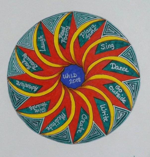 mandala in blue-green, yellow-orange, and red-orange with silver words