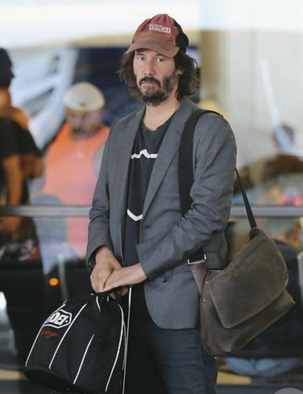 Keanu Reeves with luggage 